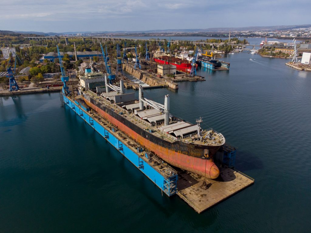 aerial view shipyard dry dock maintenance and repair cargo ship transport and oil ships in sea