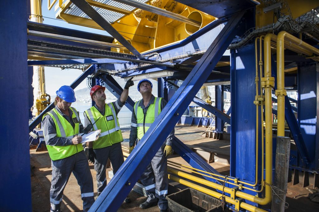 Crew onboard a ship inspecting with clipboard