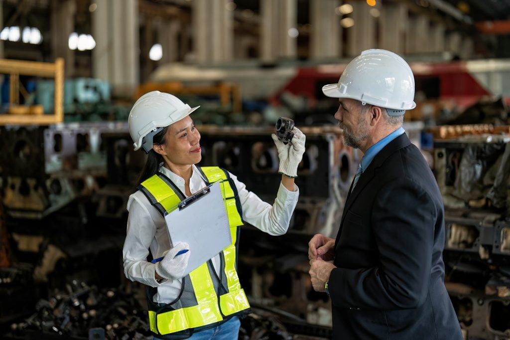 Maintenance manager meet engineer checking spare part ready for overhaul repair engine machine